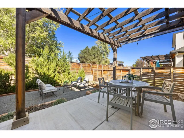 a view of a chairs and table in patio