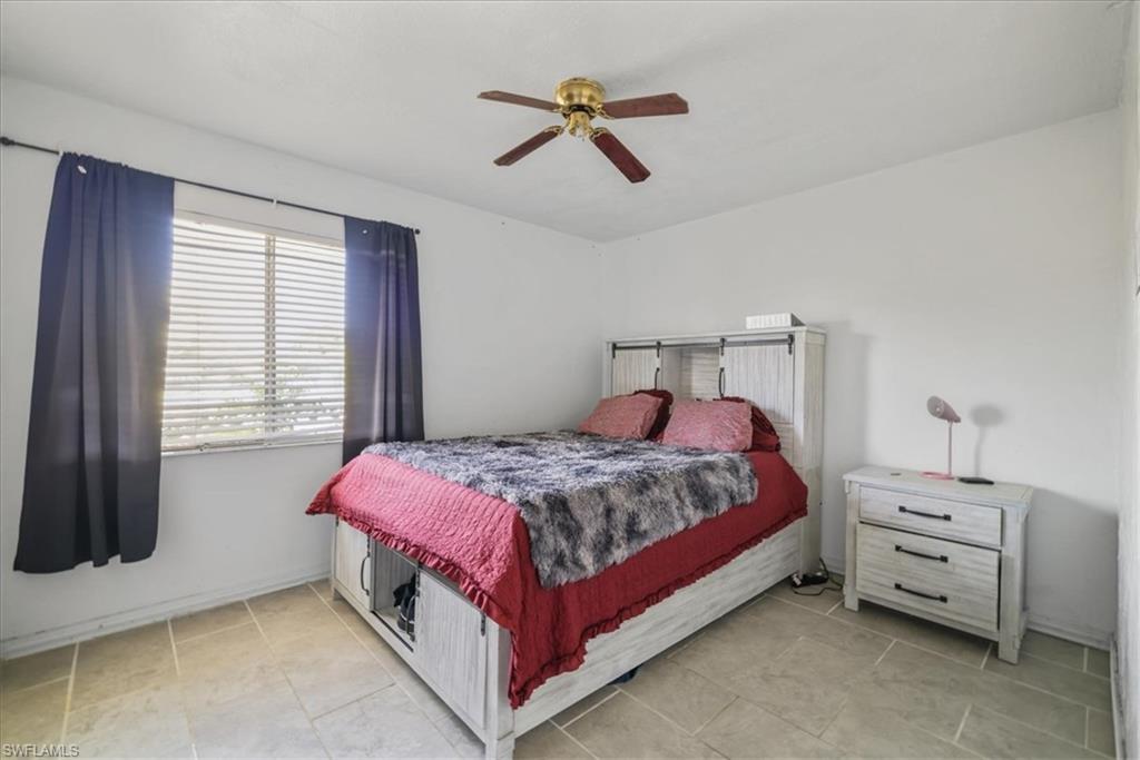 4077 South Edgewater Circle LaBelle, FL 33935 - Photo 17 of 30 a bed room with a bed and a window