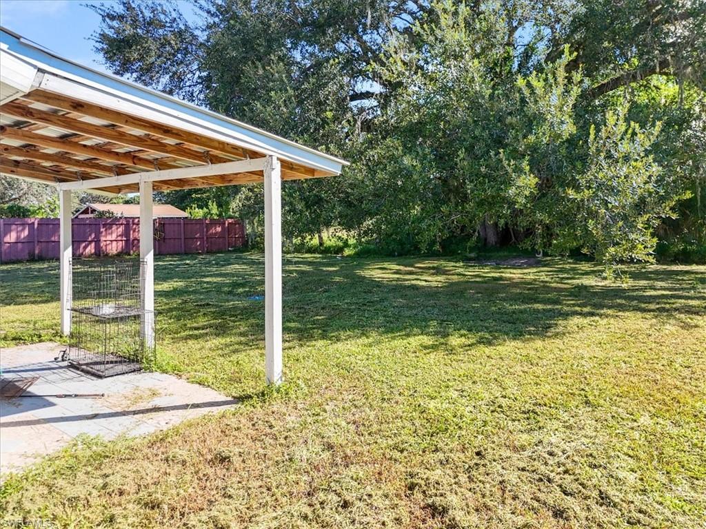 4077 South Edgewater Circle LaBelle, FL 33935 - Photo 23 of 30 a view of a house with a yard