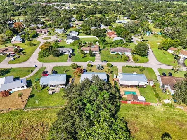 an aerial view of residential house with outdoor space and swimming pool