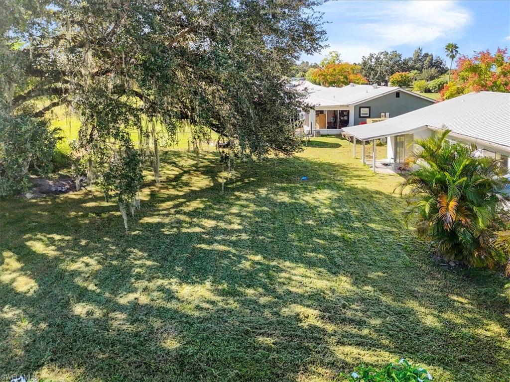 4077 South Edgewater Circle LaBelle, FL 33935 - Photo 3 of 30 a view of a house with a yard