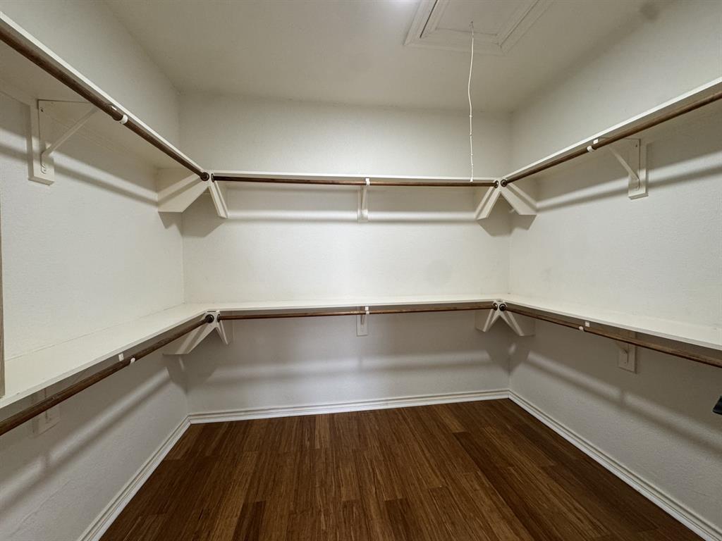 1912 Signal Ridge Place Rockwall, TX 75032 - Photo 13 of 21 a view of a room with wooden floor