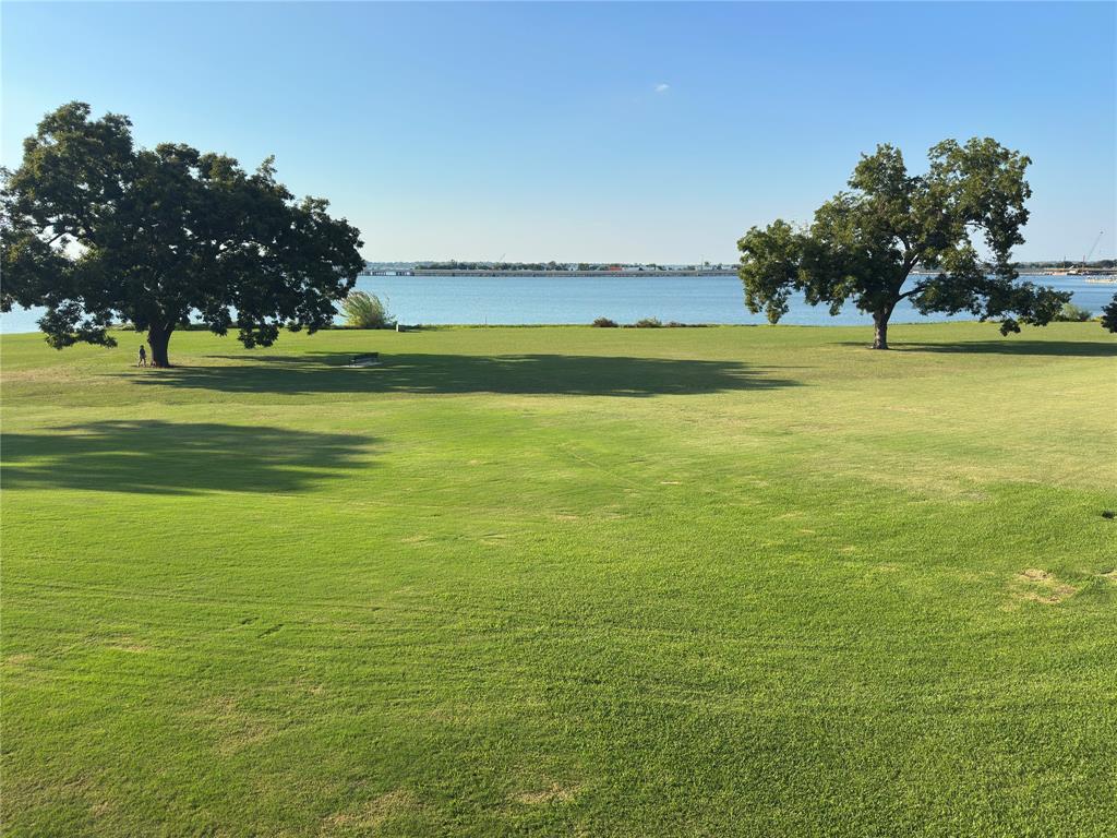 1912 Signal Ridge Place Rockwall, TX 75032 - Photo 2 of 21 a view of a large pool with lawn chairs and a big yard