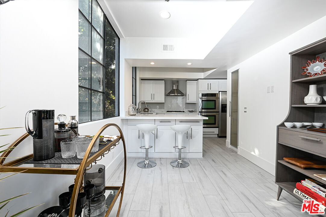 235 South Reeves Drive, Unit 301 Beverly Hills, CA 90212 - Photo 5 of 18 a view of kitchen with breakfast area
