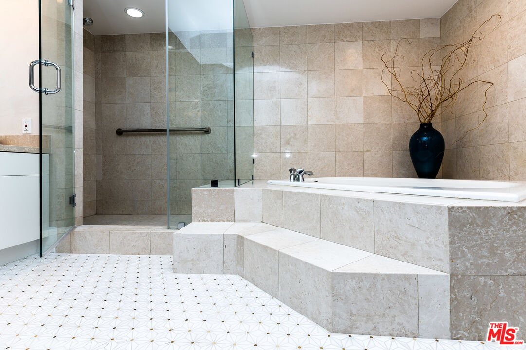 235 South Reeves Drive, Unit 301 Beverly Hills, CA 90212 - Photo 10 of 18 a bathroom with a bathtub and shower