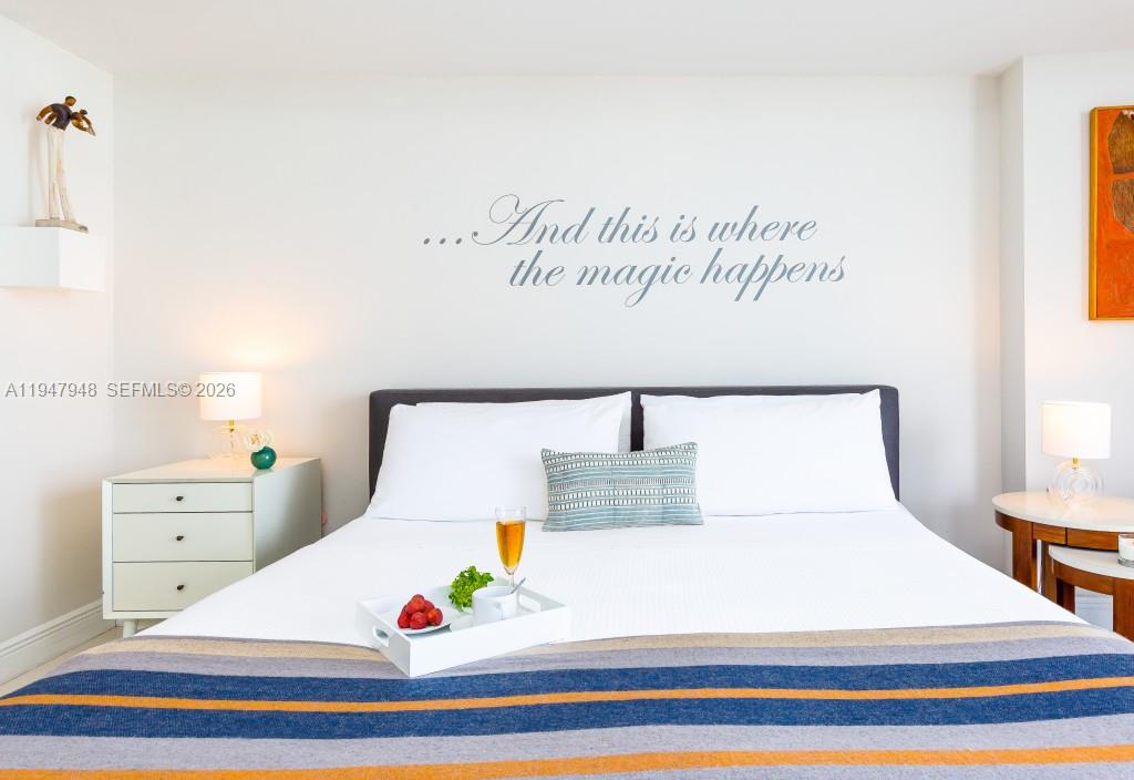 485 Brickell Avenue, Unit 4307 Miami, FL 33131 - Photo 14 of 21 a bed sitting in a bedroom and table