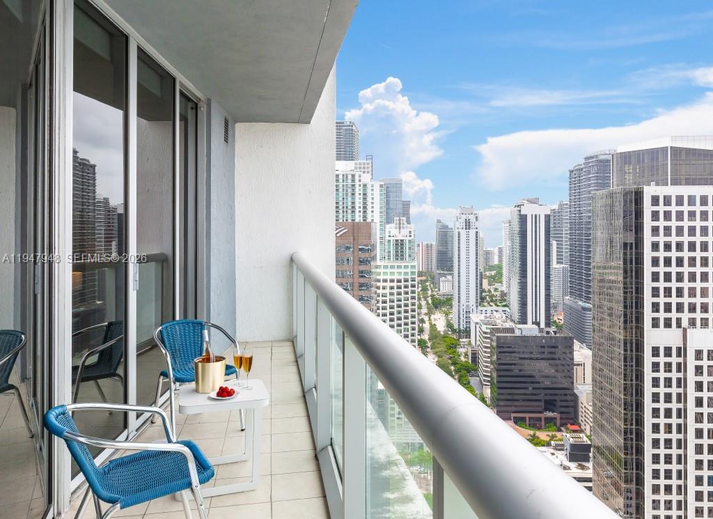485 Brickell Avenue, Unit 4307 Miami, FL 33131 - Photo 18 of 21 a balcony with furniture and a potted plant