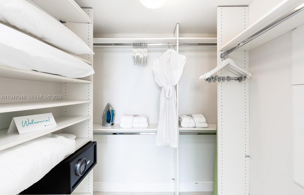 485 Brickell Avenue, Unit 4307 Miami, FL 33131 - Photo 19 of 21 a kitchen with a refrigerator a sink and a window