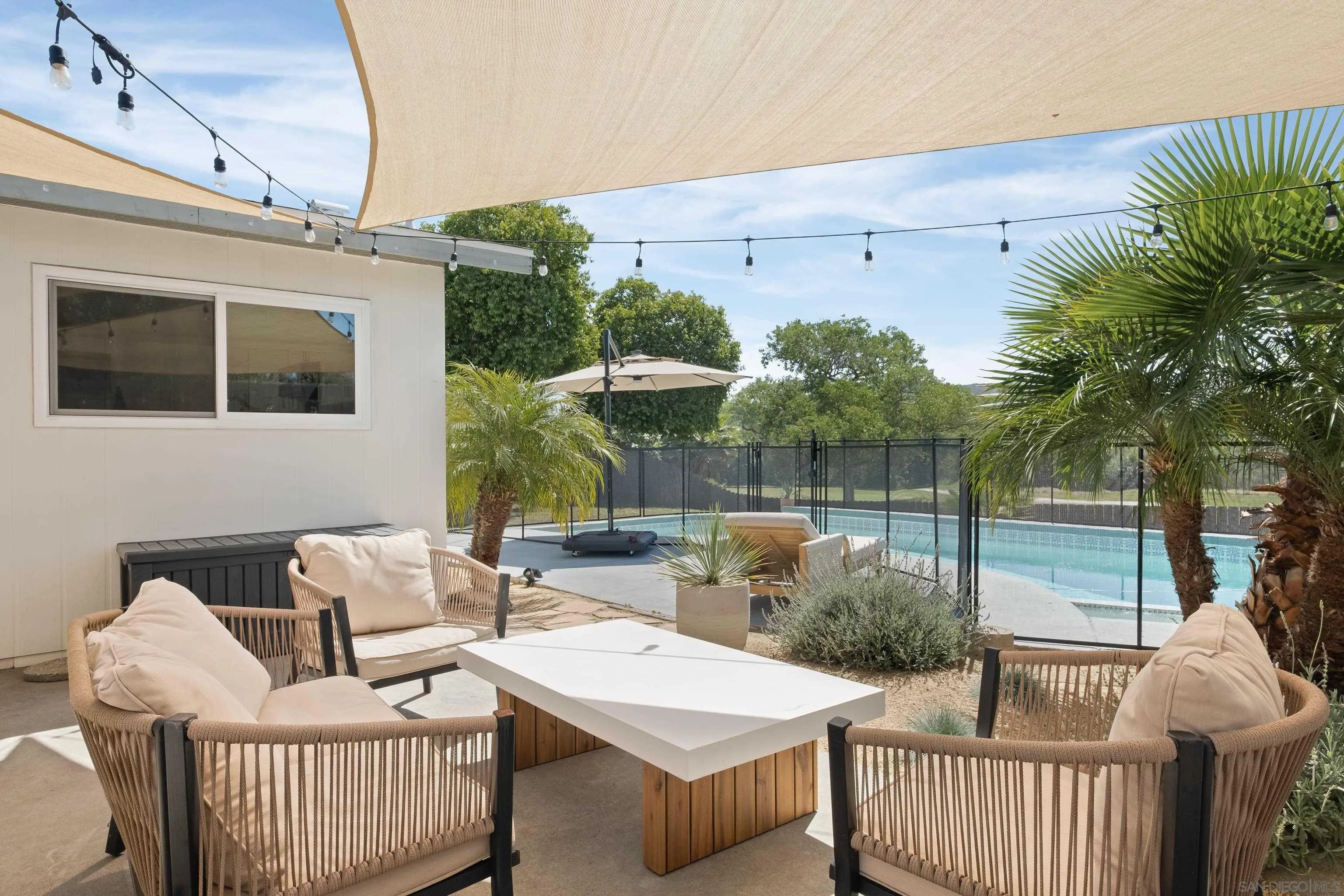 9081 Inverness Road Santee, CA 92071 - Photo 2 of 53 a view of a patio with couches table and chairs and potted plants