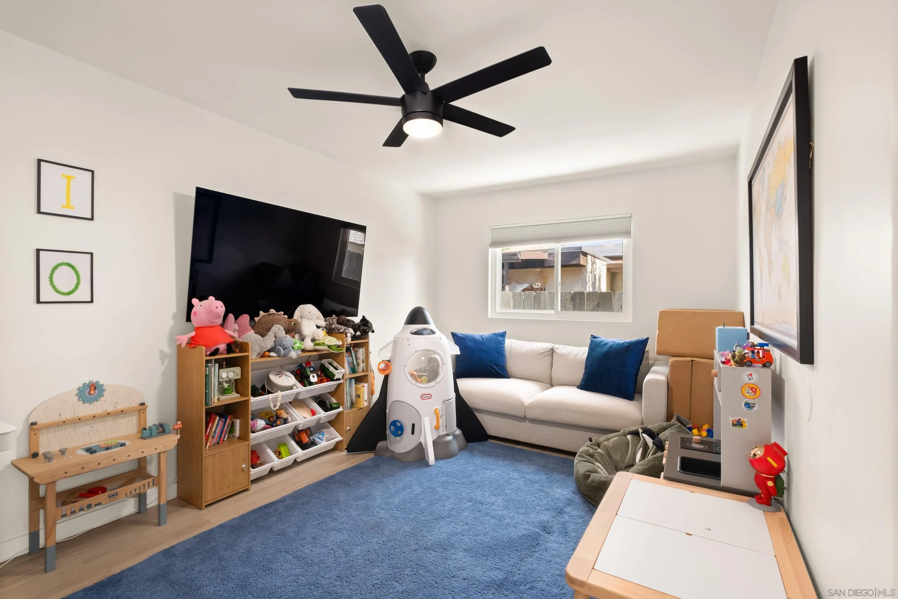 9081 Inverness Road Santee, CA 92071 - Photo 21 of 53 a living room with furniture and a flat screen tv