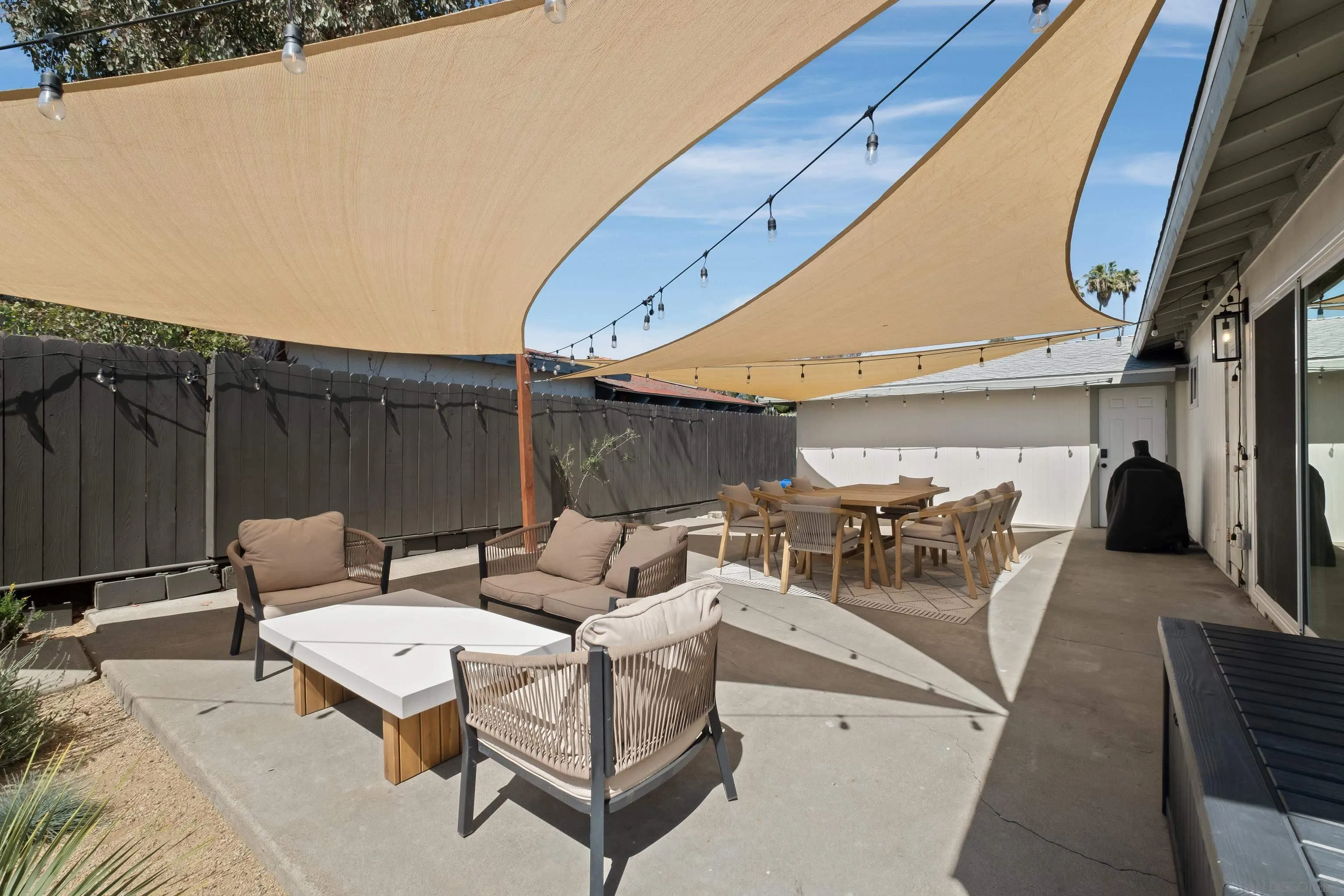 9081 Inverness Road Santee, CA 92071 - Photo 28 of 53 a patio with patio a couch and chairs