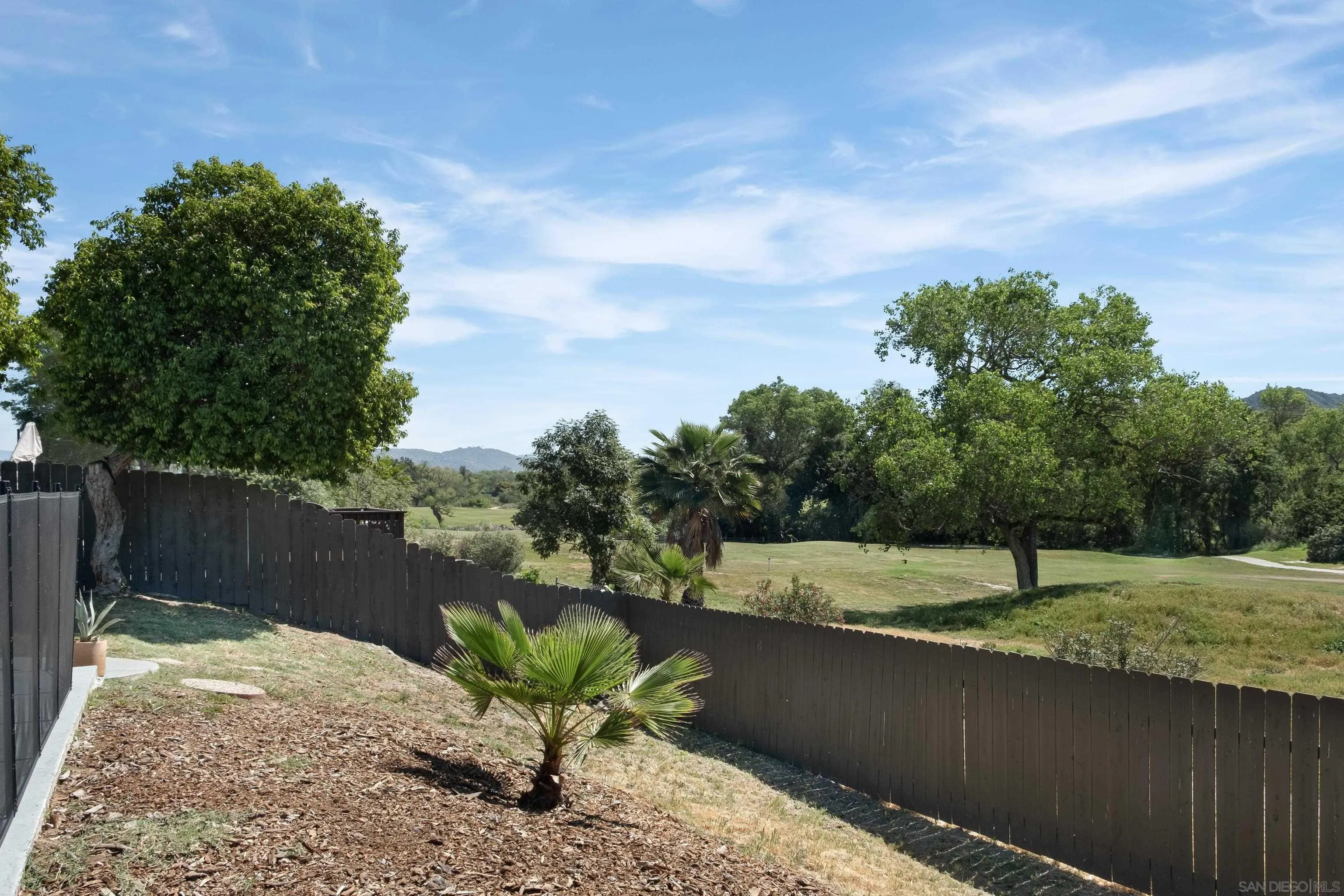 9081 Inverness Road Santee, CA 92071 - Photo 35 of 53 a view of a lake with a yard
