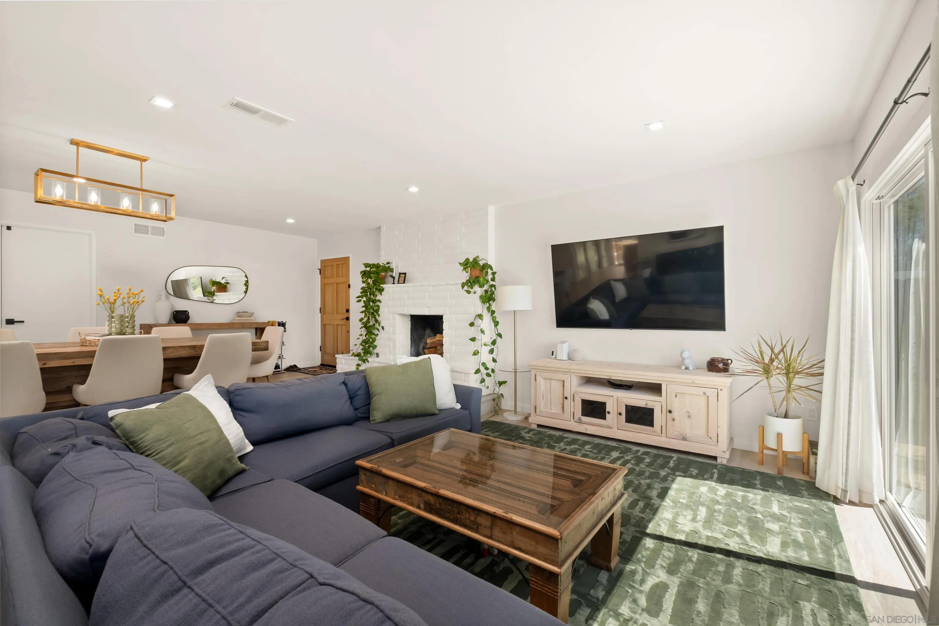 9081 Inverness Road Santee, CA 92071 - Photo 9 of 53 a living room with furniture and a flat screen tv