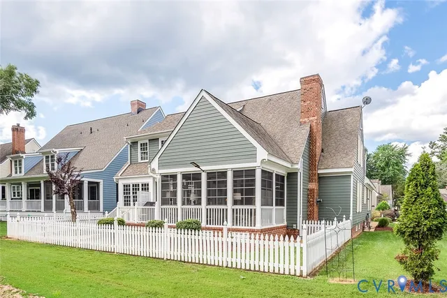 a front view of a building with a garden
