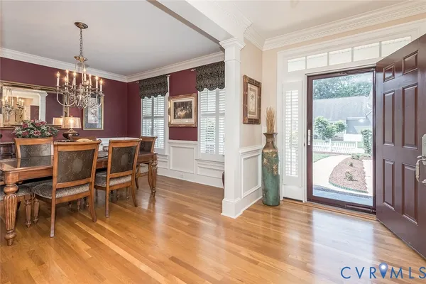 a view of a kitchen with furniture and wooden floor