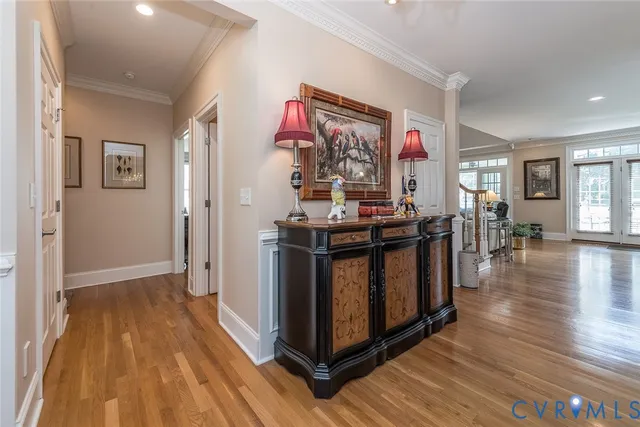 a view of a kitchen with furniture and wooden floor