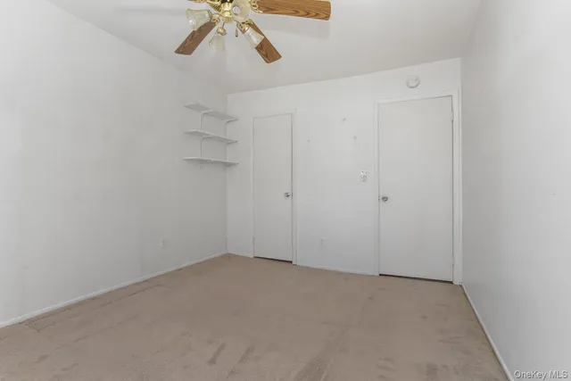 a view of a room with racks on the wall