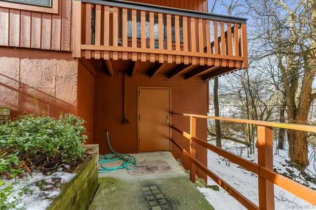 a view of a hallway with wooden walls and windows