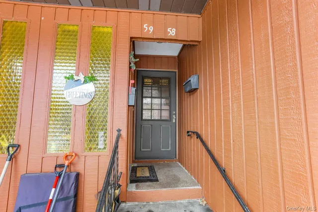 a view of an house with swimming pool and deck