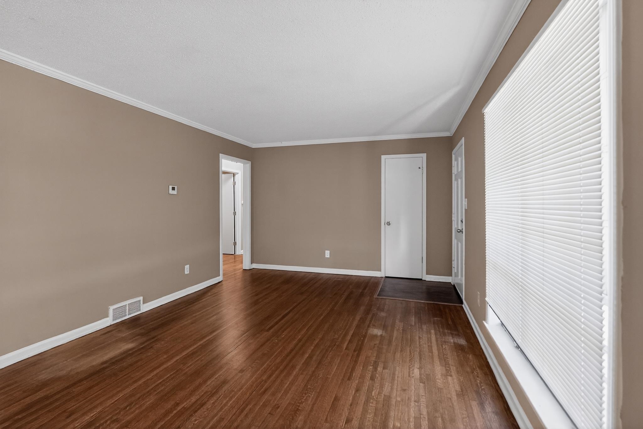 2015 East Holmes Road Memphis, TN 38116 - Photo 13 of 34 a view of an empty room with wooden floor