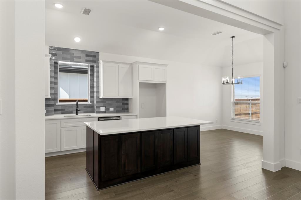 1335 Eclipse Way Wylie, TX 75098 - Photo 15 of 34 a kitchen with a sink and cabinets