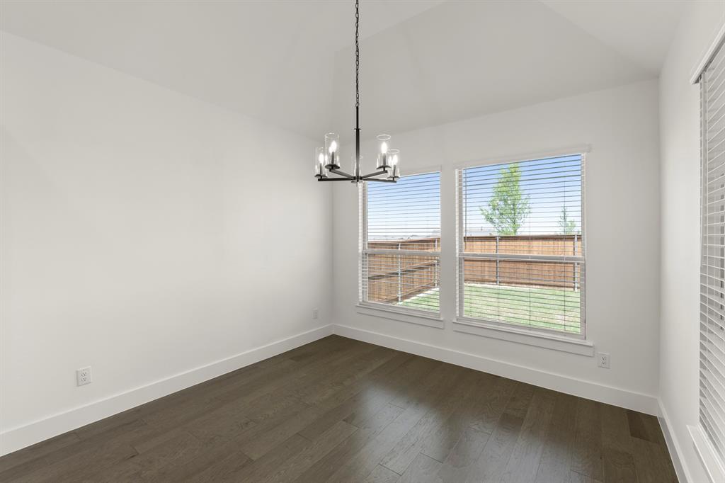 1335 Eclipse Way Wylie, TX 75098 - Photo 17 of 34 an empty room with wooden floor and windows