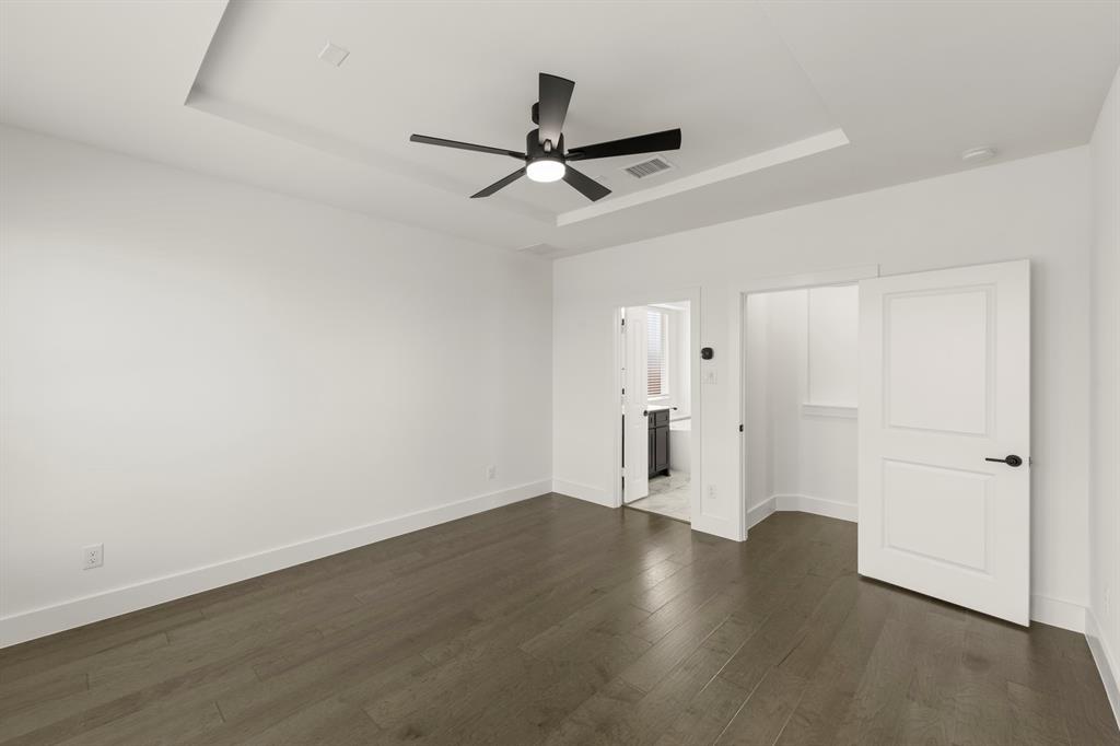 1335 Eclipse Way Wylie, TX 75098 - Photo 20 of 34 an empty room with wooden floor and ceiling fan