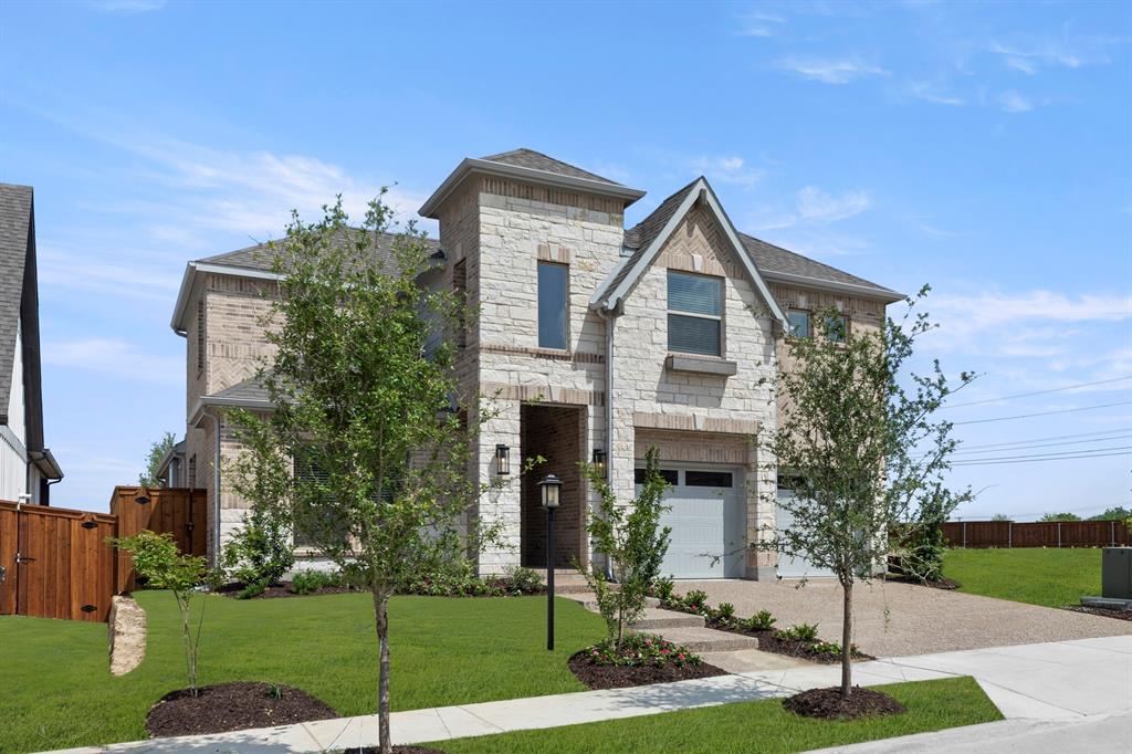 1335 Eclipse Way Wylie, TX 75098 - Photo 2 of 34 a front view of a house with garden