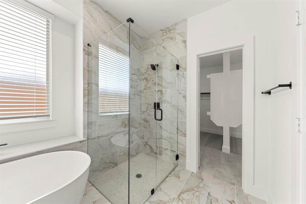 1335 Eclipse Way Wylie, TX 75098 - Photo 24 of 34 a bathroom with a shower and a bathtub