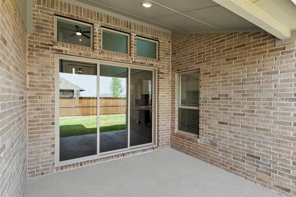 1335 Eclipse Way Wylie, TX 75098 - Photo 29 of 34 a view of a brick house with a large window