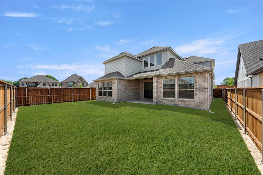 1335 Eclipse Way Wylie, TX 75098 - Photo 30 of 34 a view of a house with backyard and porch