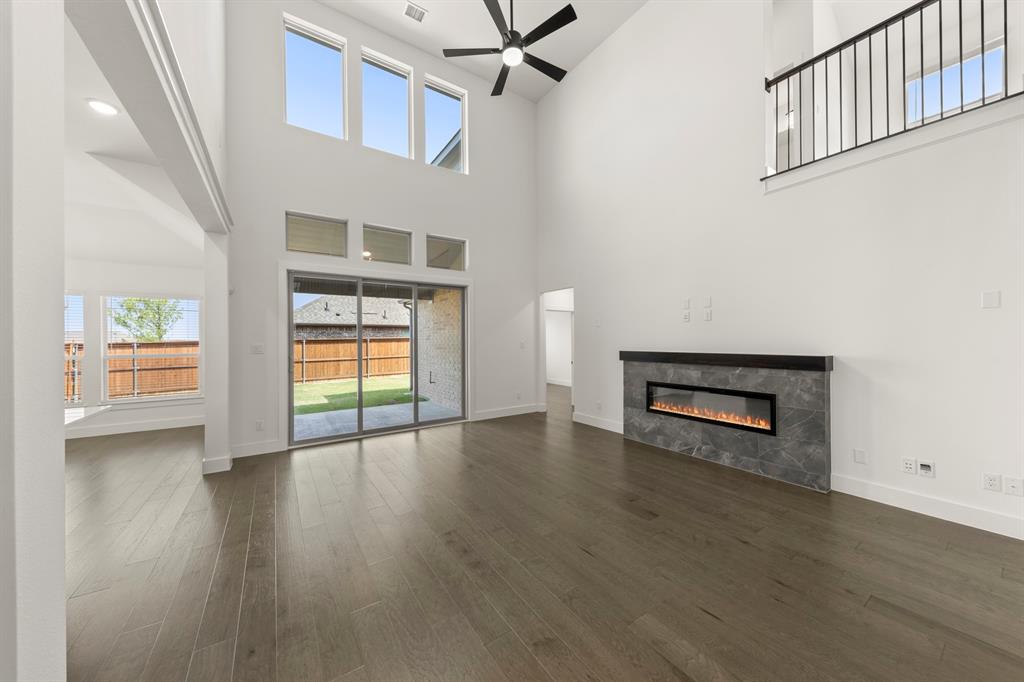 1335 Eclipse Way Wylie, TX 75098 - Photo 8 of 34 wooden floor in an empty room with a window