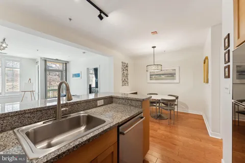 a kitchen with a sink and breakfast area