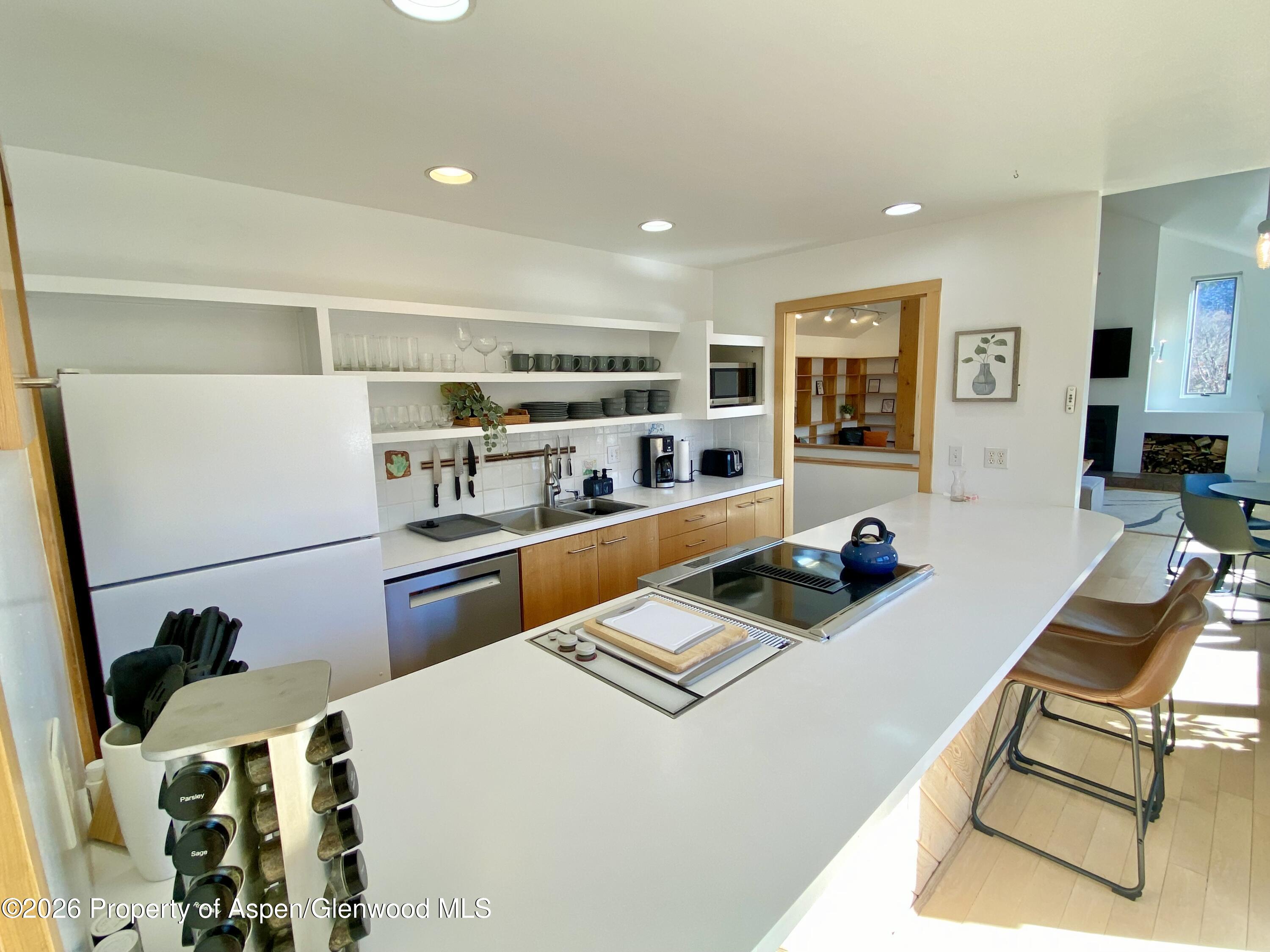 216 East Homestead Drive Basalt, CO 81621 - Photo 25 of 26 a room with furniture a flat screen tv and a table