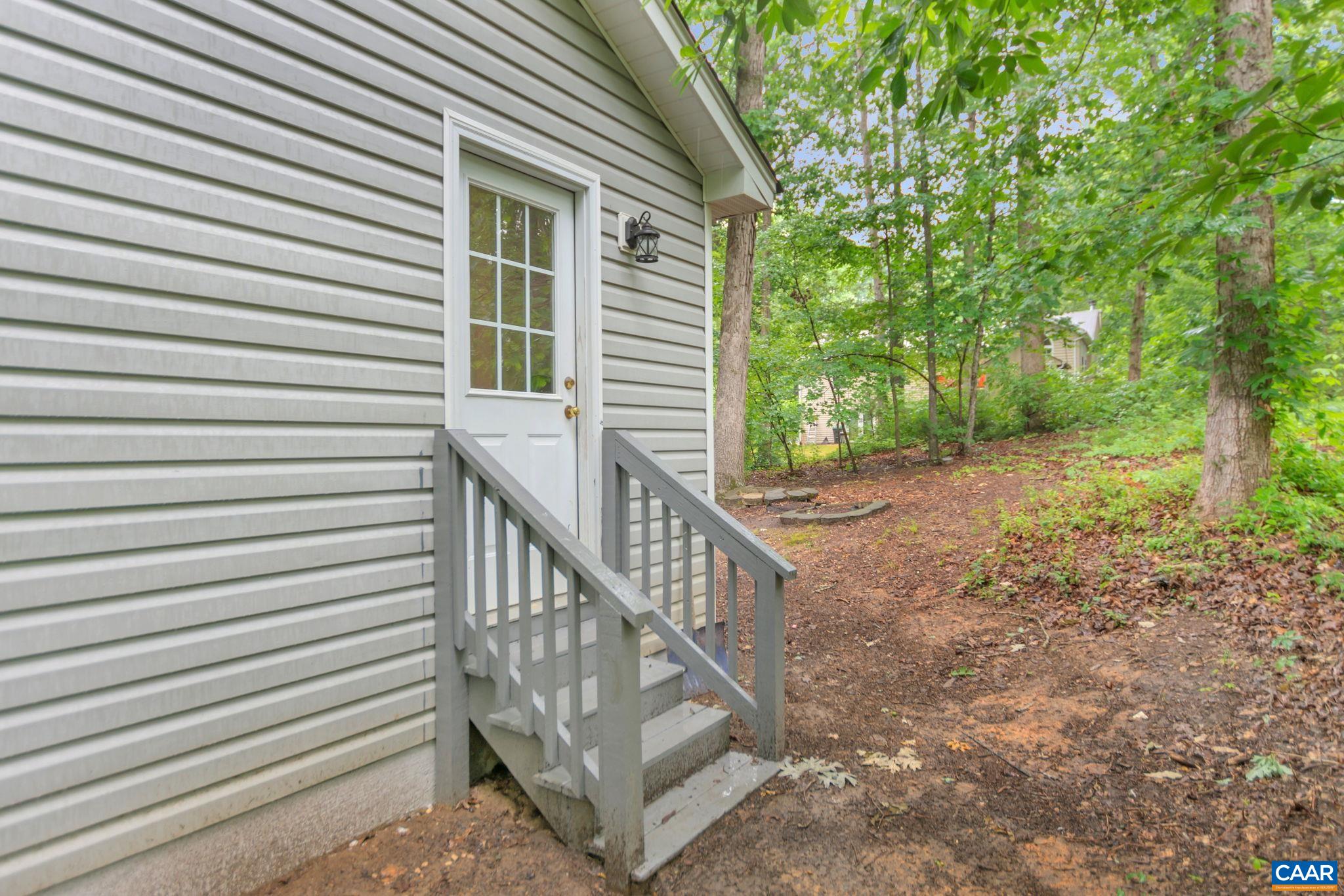 14 Hatchechubee Road Palmyra, VA 22963 - Photo 26 of 30 a view of a house with backyard and a trees