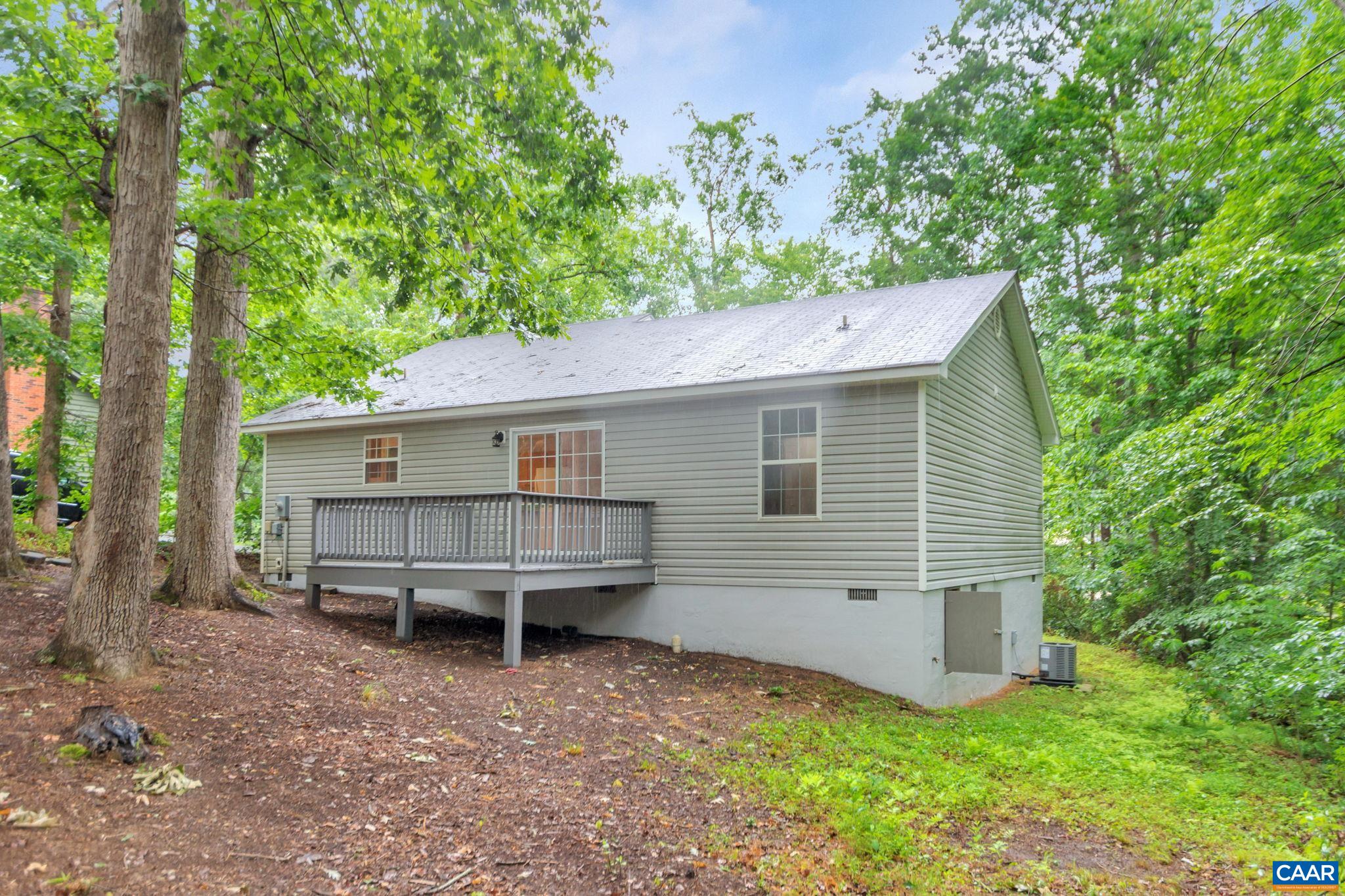 14 Hatchechubee Road Palmyra, VA 22963 - Photo 27 of 30 a backyard of a house with table and chairs