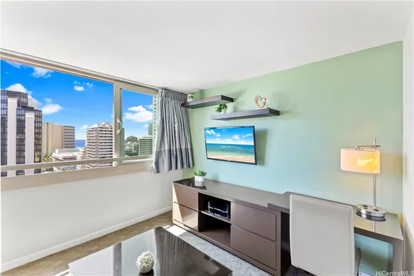 a view of a kitchen with furniture and a window