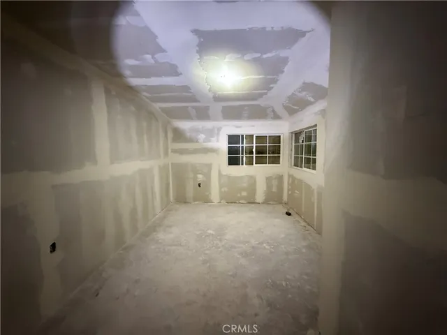 a view of a room with wooden walls