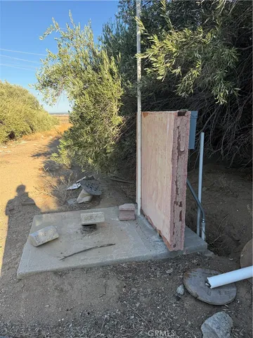 a front view of a house with a yard and seating space