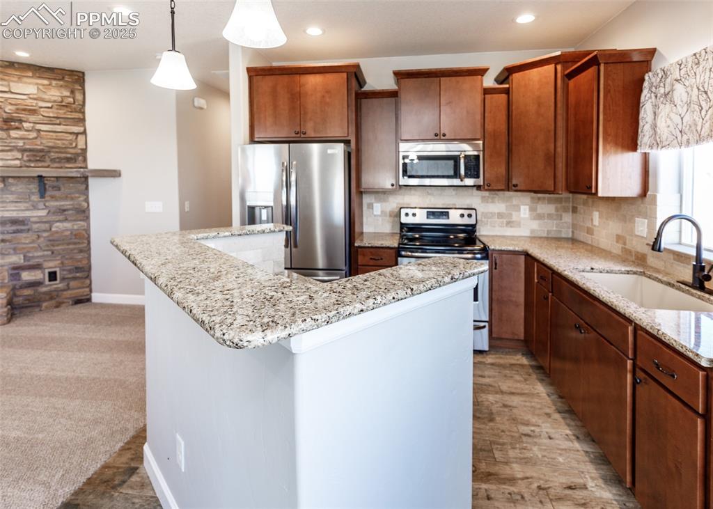 2105 Slocum Road Peyton, CO 80831 - Photo 8 of 27 Great kitchen with stainless appliances and granite countertops.