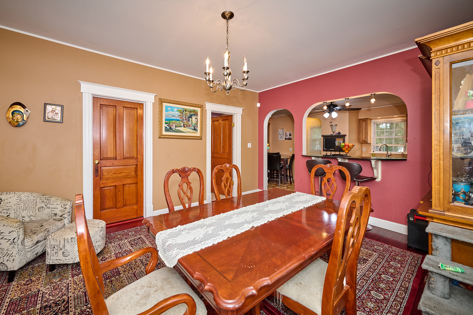 703 North Arlington Heights Road Arlington Heights, IL 60004 - Photo 14 of 28 a living room with furniture a chandelier and a dining table