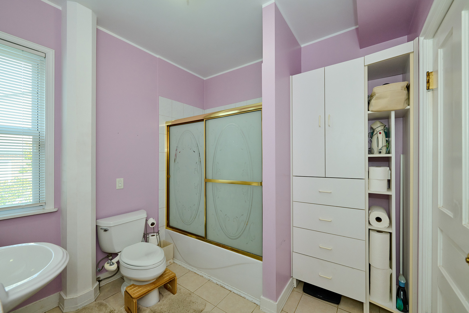 703 North Arlington Heights Road Arlington Heights, IL 60004 - Photo 18 of 28 a bathroom with a sink a toilet a mirror and shower