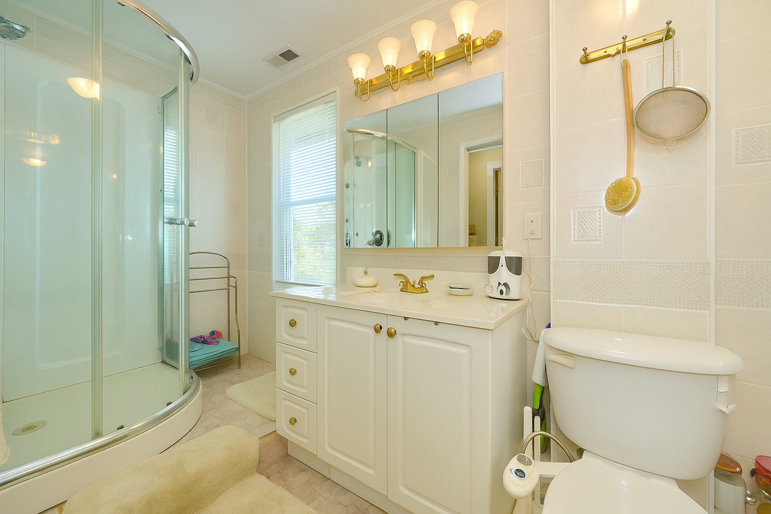 703 North Arlington Heights Road Arlington Heights, IL 60004 - Photo 24 of 28 a bathroom with a sink a toilet and shower