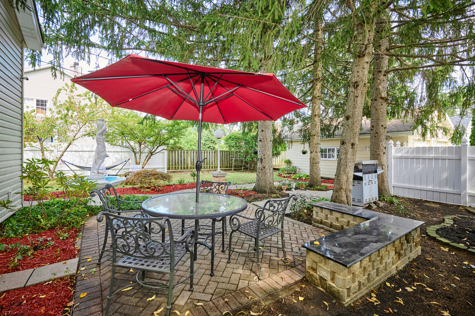 703 North Arlington Heights Road Arlington Heights, IL 60004 - Photo 7 of 28 an outdoor space with furniture and umbrella
