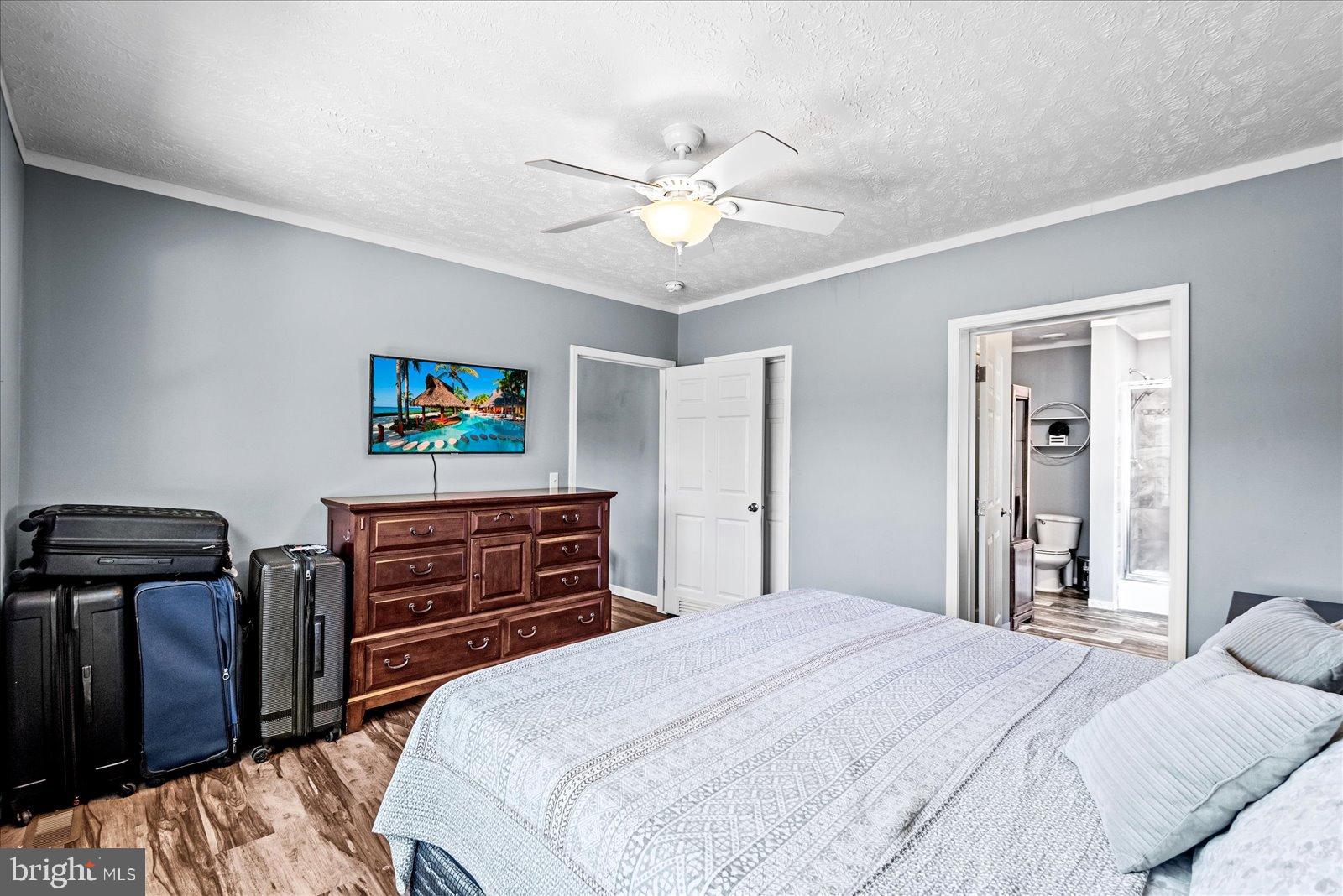 6600 Stubbs Bridge Road Spotsylvania, VA 22551 - Photo 17 of 37 Cozy bedroom with modern touches and light.