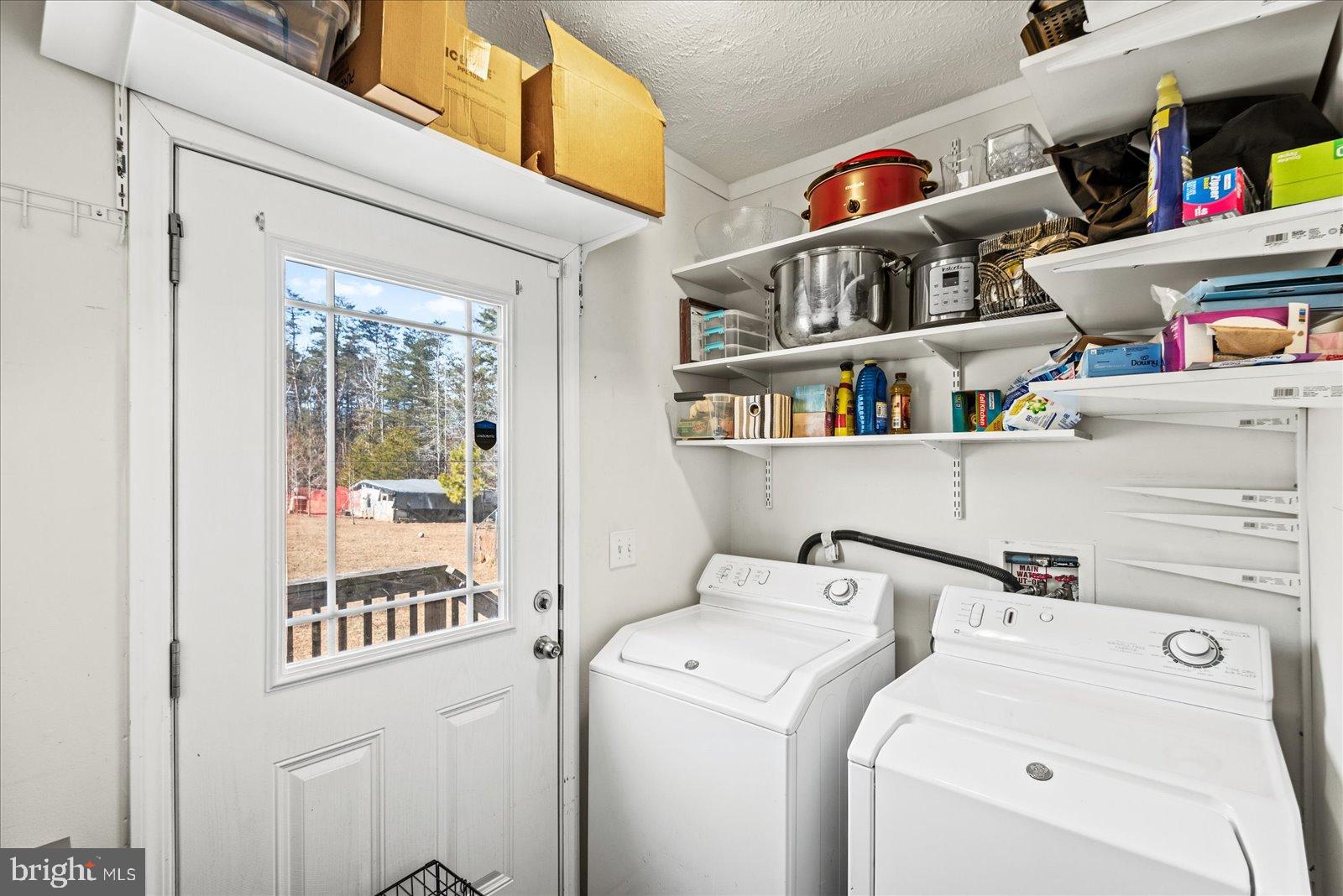 6600 Stubbs Bridge Road Spotsylvania, VA 22551 - Photo 26 of 37 Bright laundry room with ample storage space.