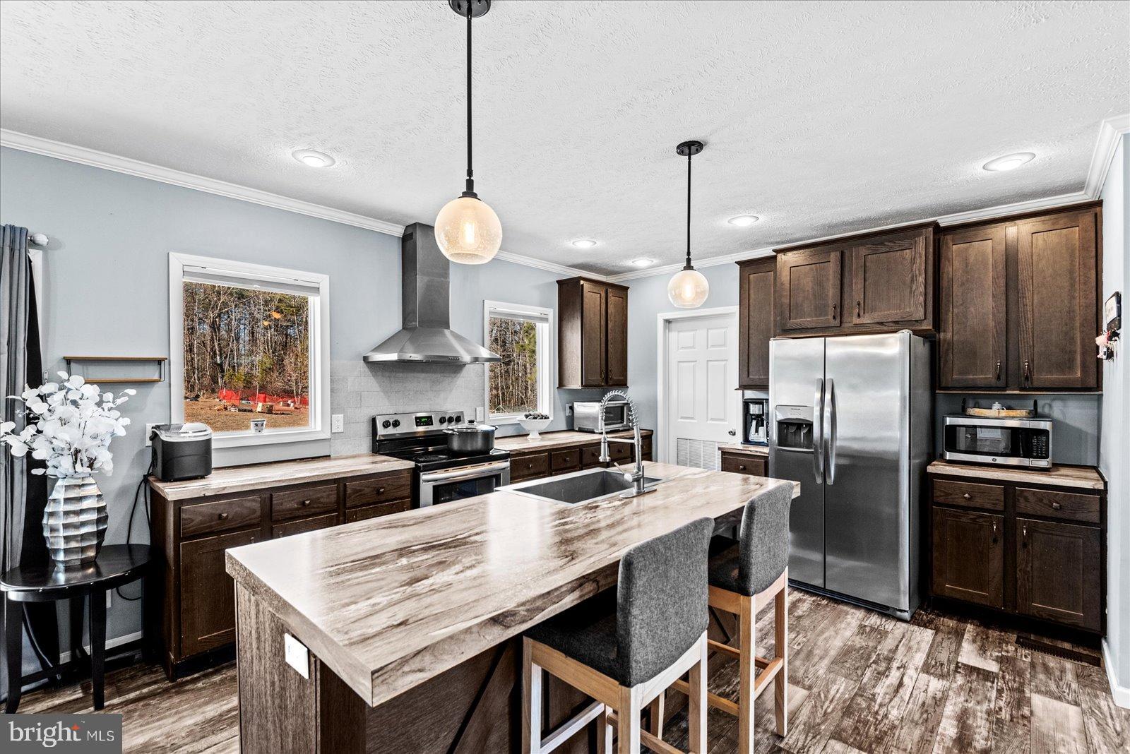 6600 Stubbs Bridge Road Spotsylvania, VA 22551 - Photo 9 of 37 Modern kitchen with sleek finishes.