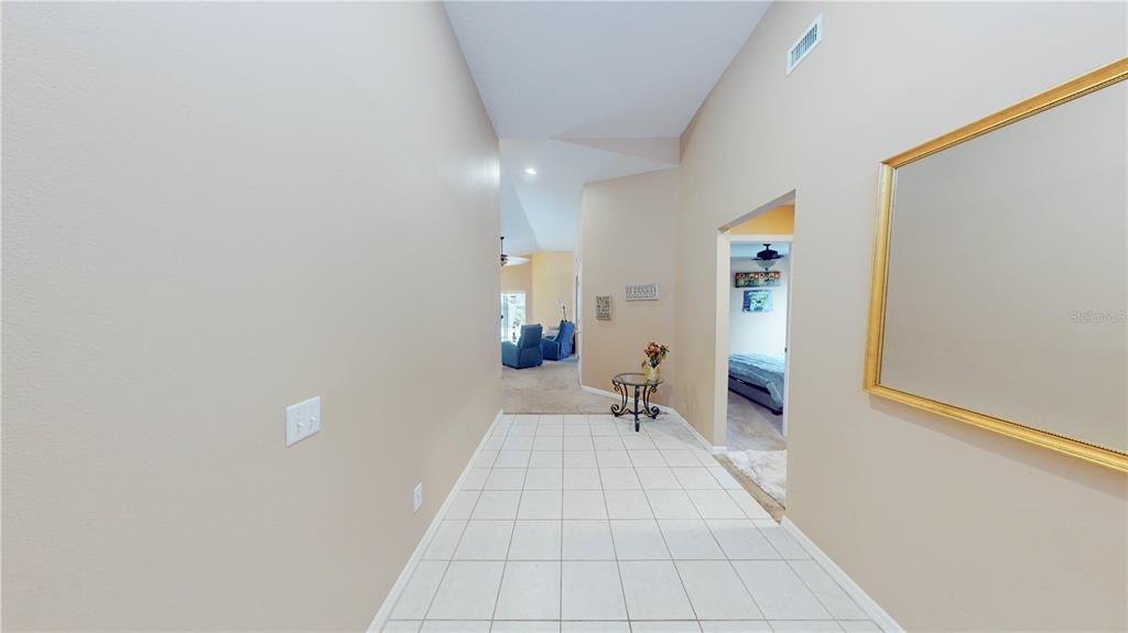 1103 Mallory Point Drive Valrico, FL 33596 - Photo 2 of 21 a view of a room with wooden floor and furniture
