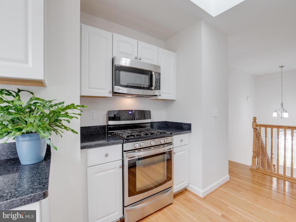 976 Pebblestone Road Pasadena, MD 21122 - Photo 11 of 39 Bonus skylight in kitchen brings in natural light