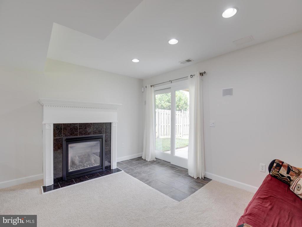 976 Pebblestone Road Pasadena, MD 21122 - Photo 25 of 39 Easy ambiance with gas fireplace